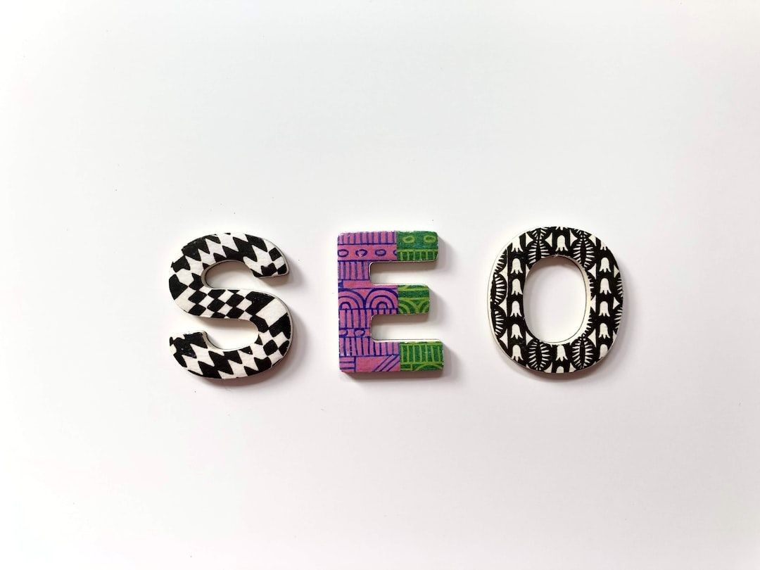 SEO letters with artistic patterns on a white background.